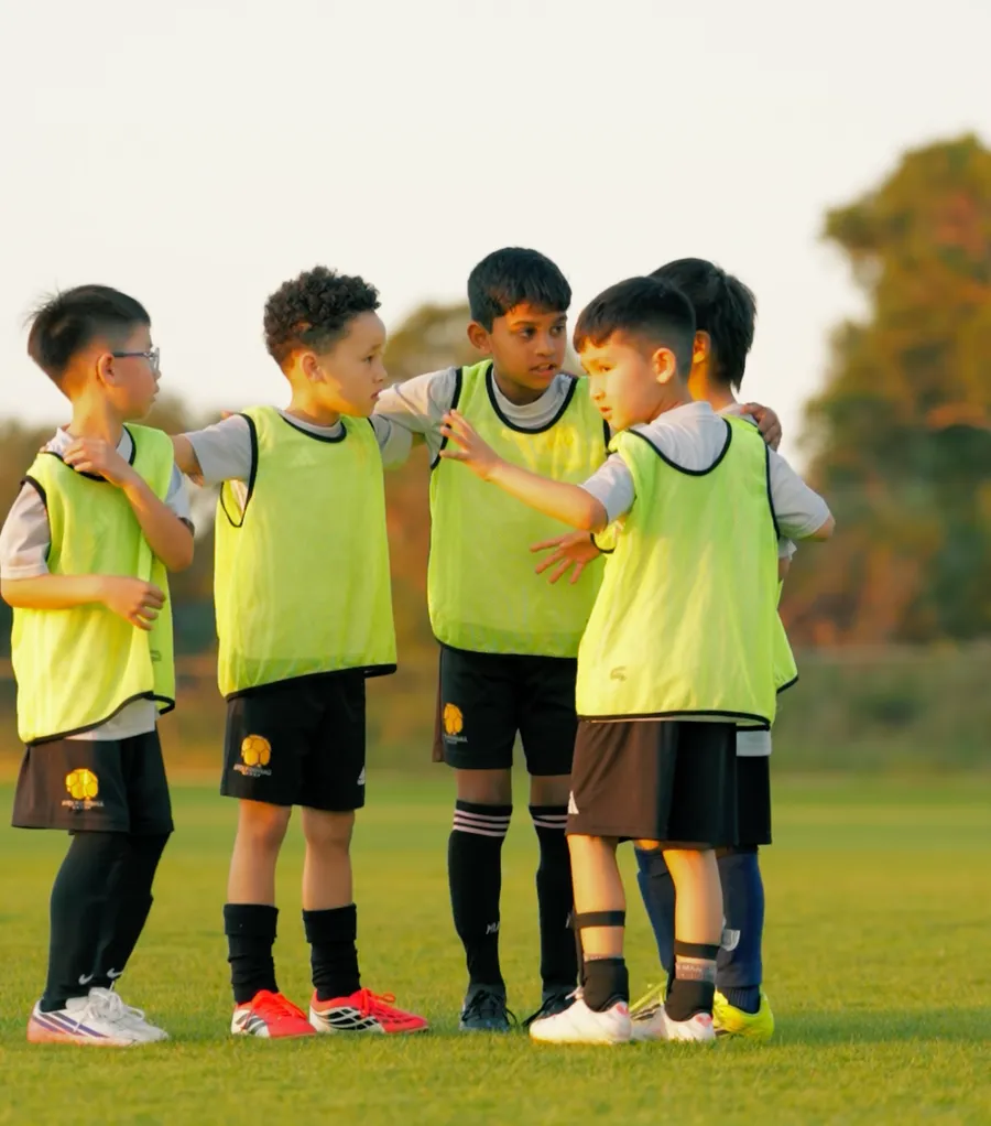 Players with arms around each other in a team huddle